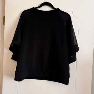 Black top with sheer sleeves